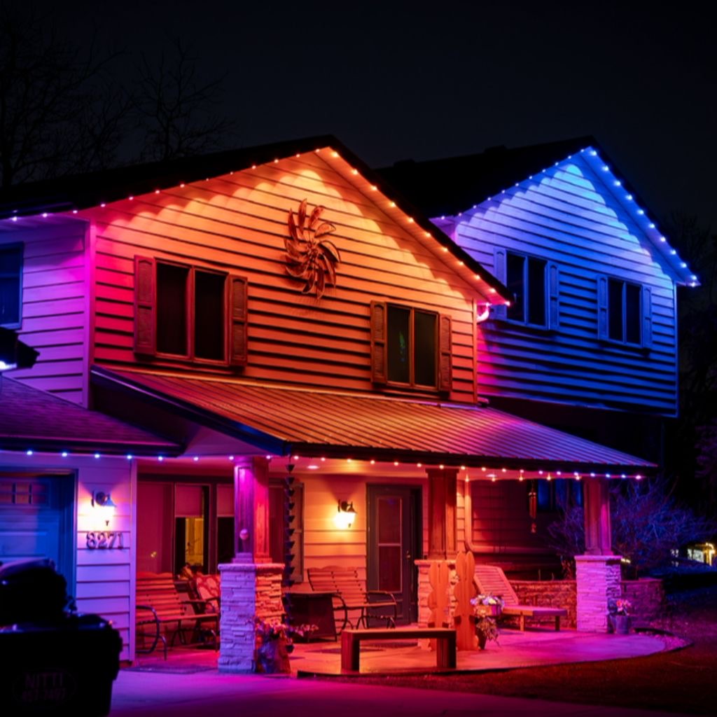 Colorful pink, orange and blue permanent lights around a covered porch